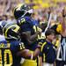 Michigan quarterback Devin Gardner looks up and clasps his hands as he celebrates after scoring a touchdown against Northwestern in the first quarter at Michigan Stadium on Saturday. Melanie Maxwell I AnnArbor.com